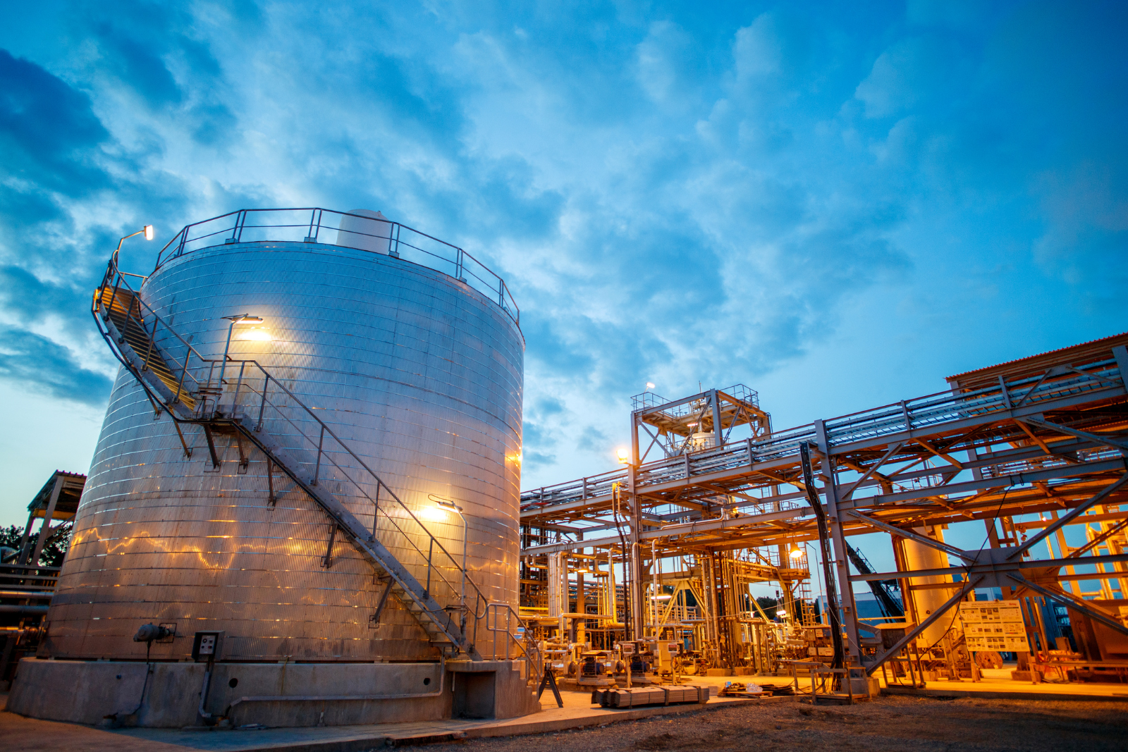 Chemical and process plant with distillation towers and pipework served by variable frequency drive systems